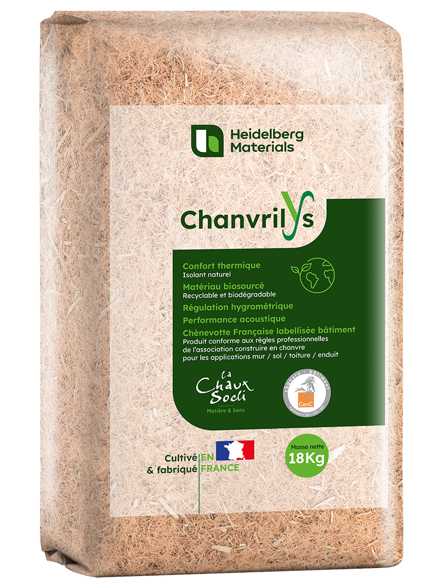 A rectangular package of "Chanvrilys" hemp insulation material by Heidelberg Materials, featuring a natural beige color with a green label on the front. The label includes brand logos, text describing its eco-friendly properties, and indicates an 18kg weight. French origin is displayed with a French flag icon.